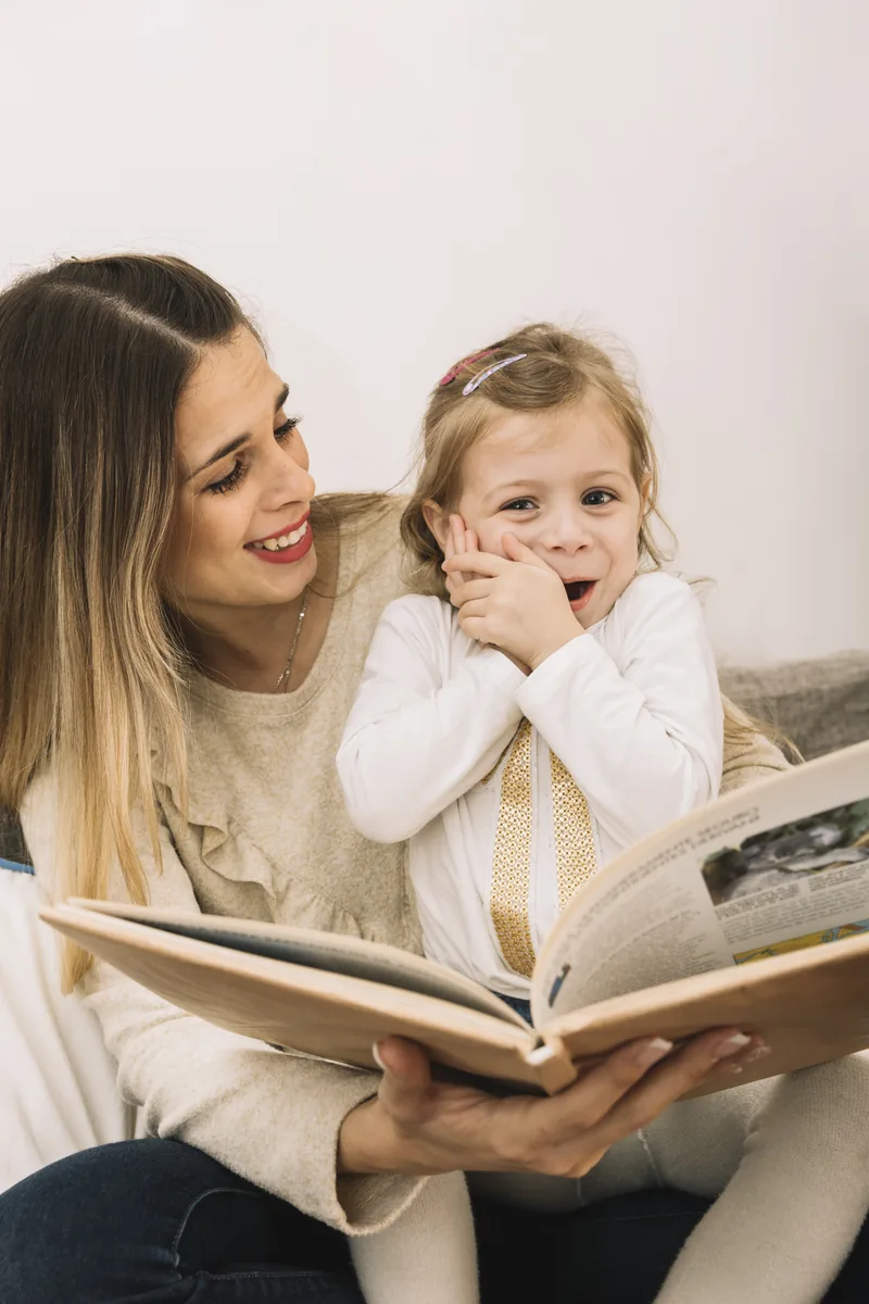 A parent reading with a young child