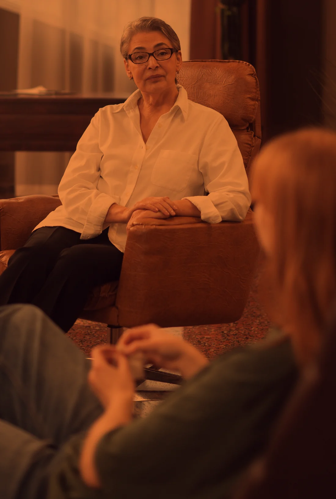 A social worker listening to a client